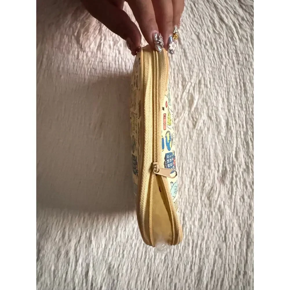 Cream Travel-themed pencil case/ make up bag  with l travel icons '
